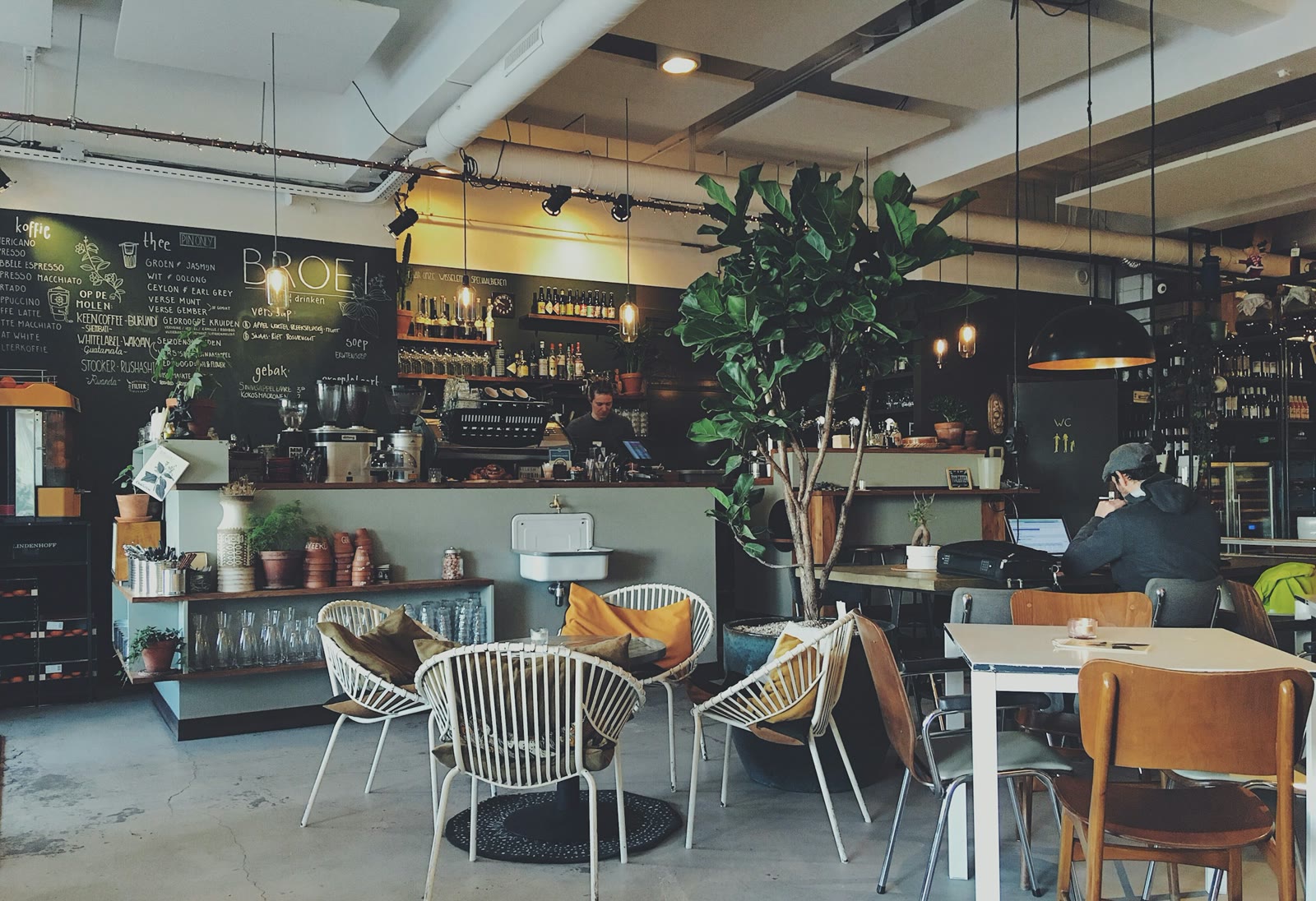 A welcoming neighbourhood cafe with an open counter and sunlit seating